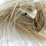 Wall lamp in natural fibres, woven straw with fringes.