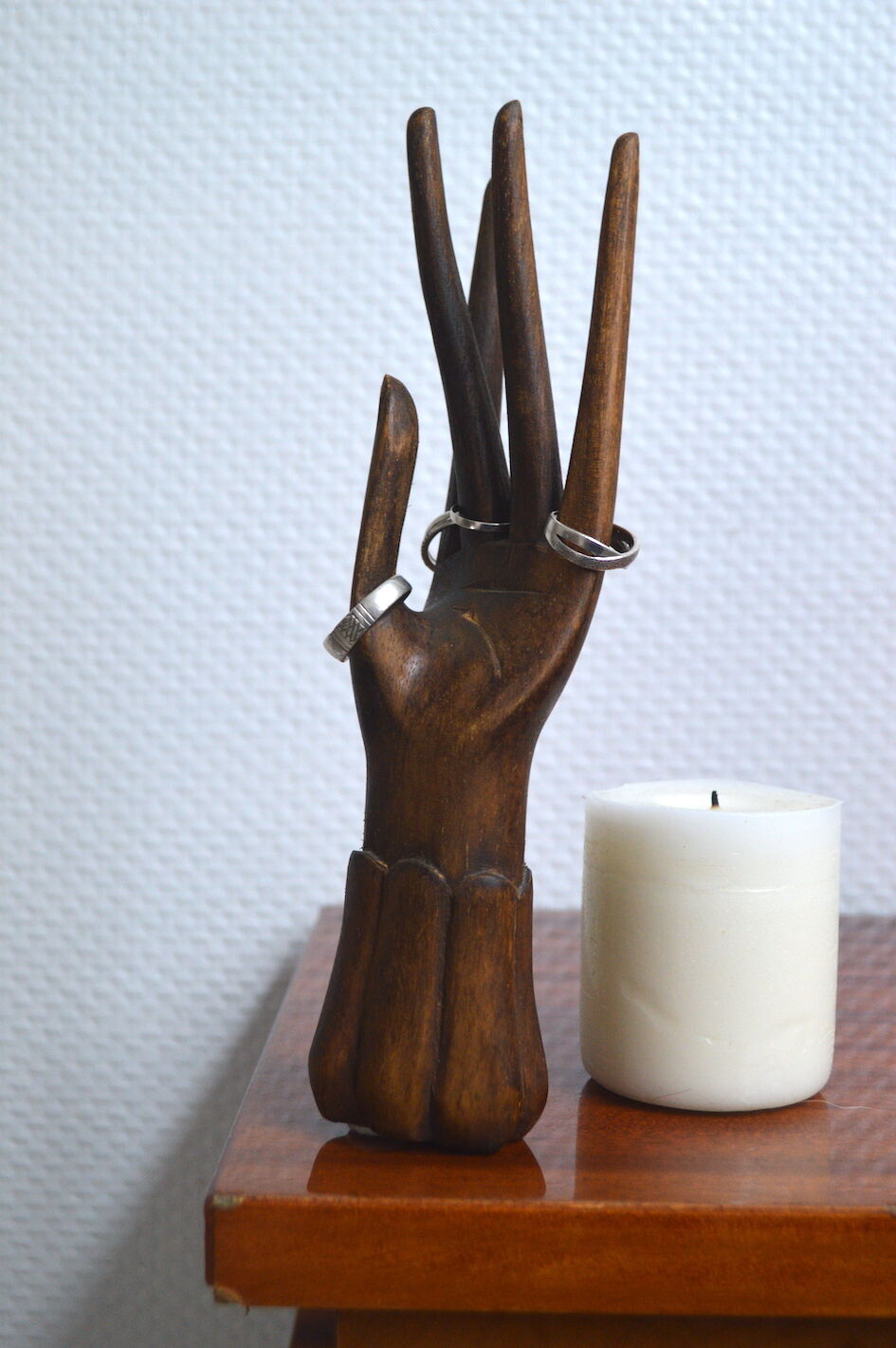 Carved wooden baguier hand