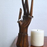 Carved wooden baguier hand
