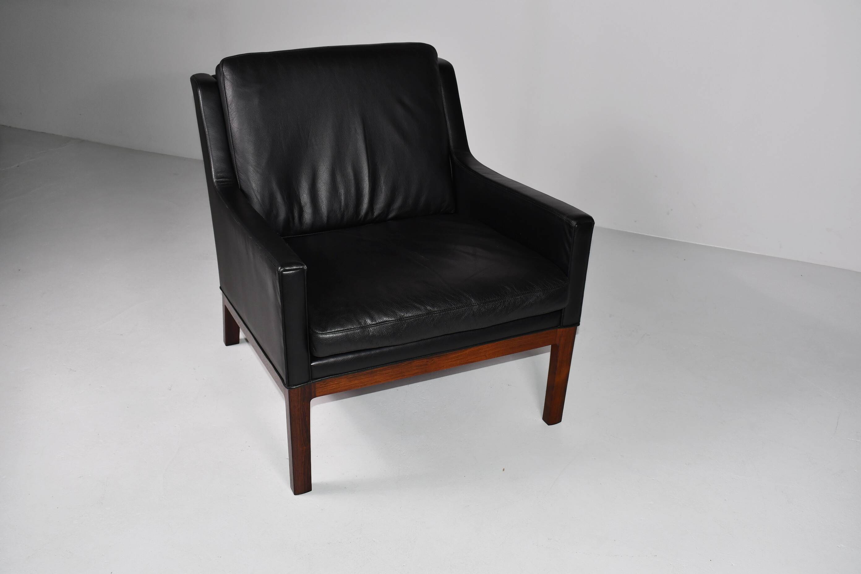 Leather and rosewood armchair by Kai lyngfeldt-Larsen. Denmark