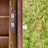 Old carved wooden medicine cabinet with beveled mirror