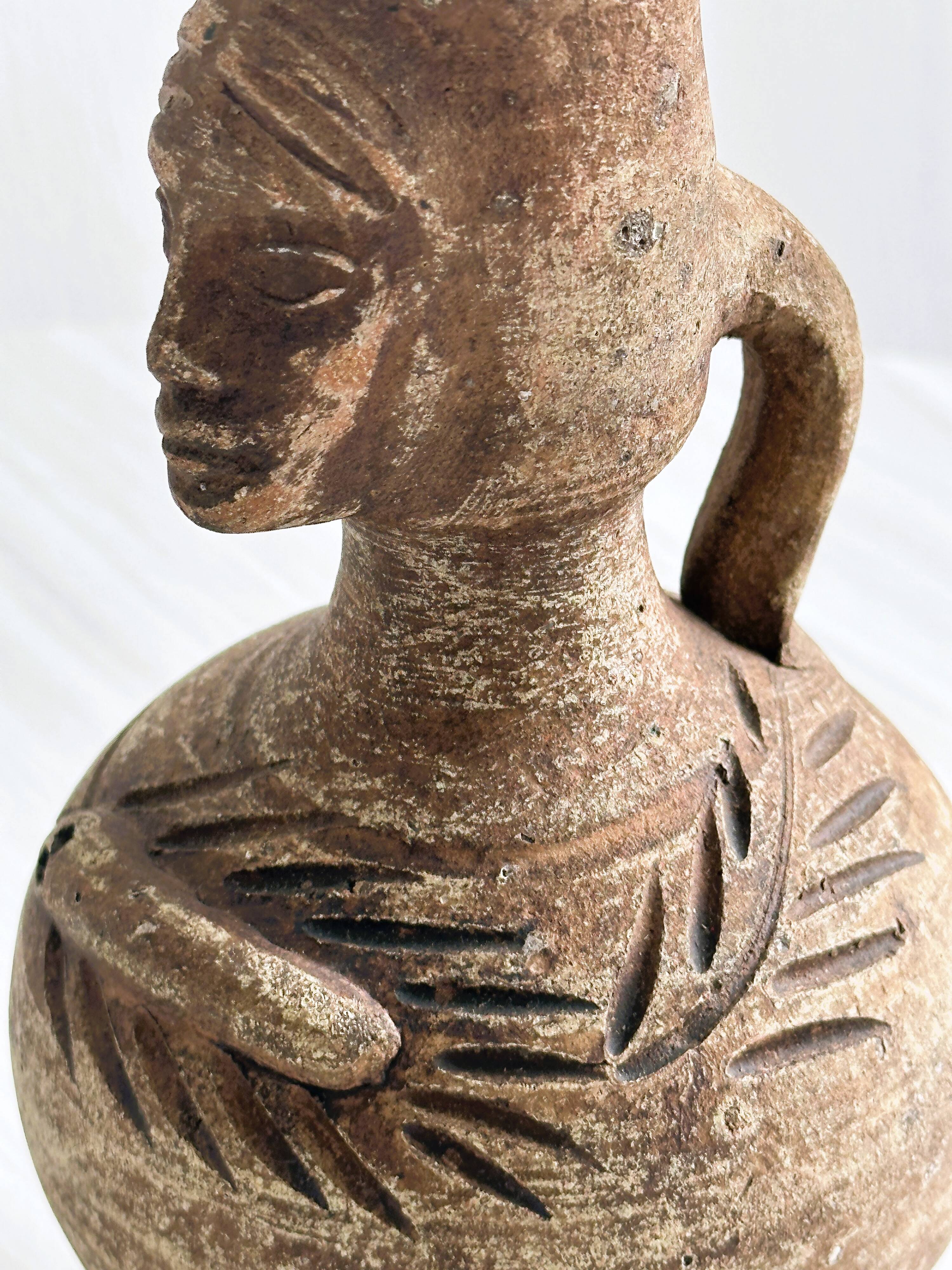 Ceramic woman face vase pitcher.