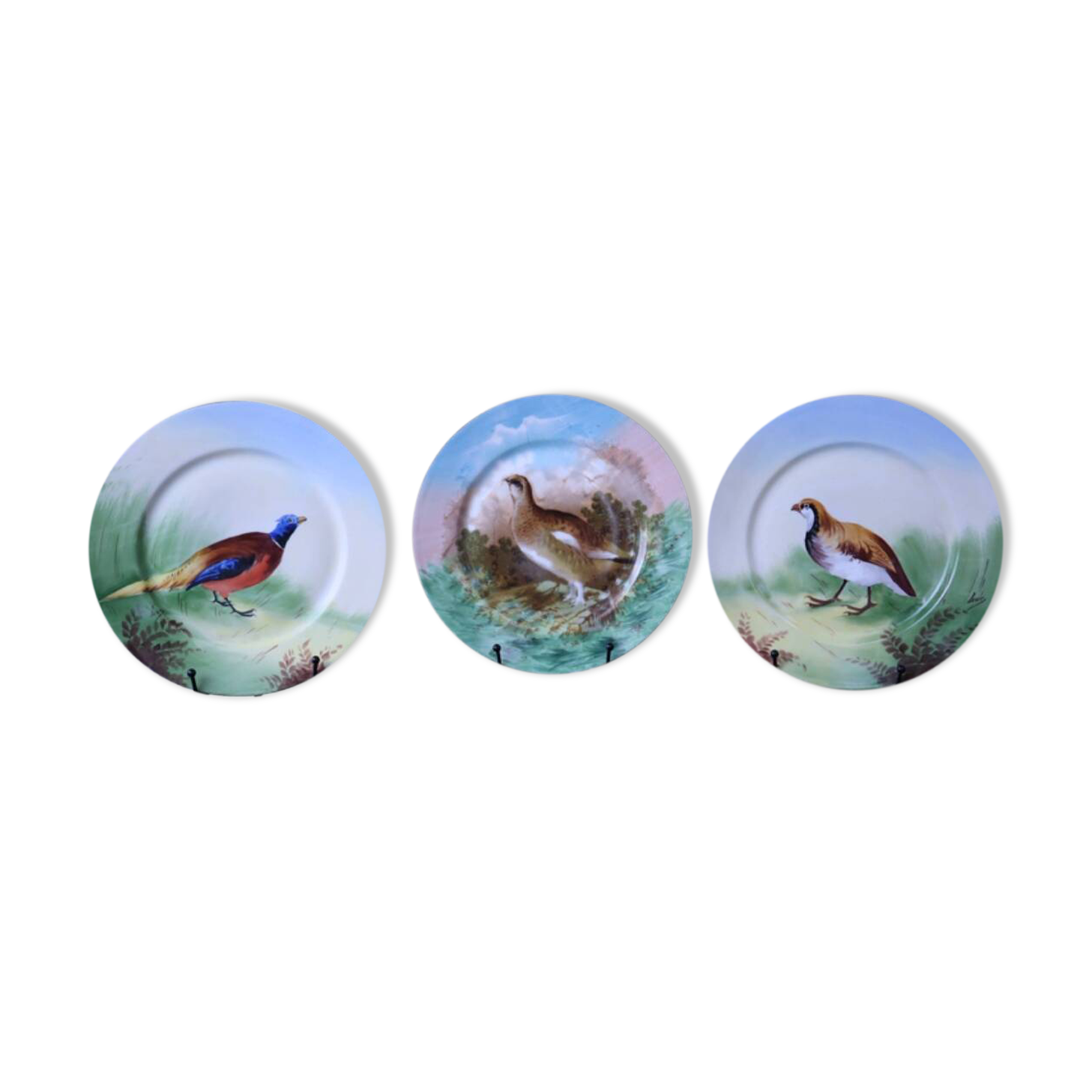 3 decorative porcelain plates from Limoges featuring partridges and pheasants.