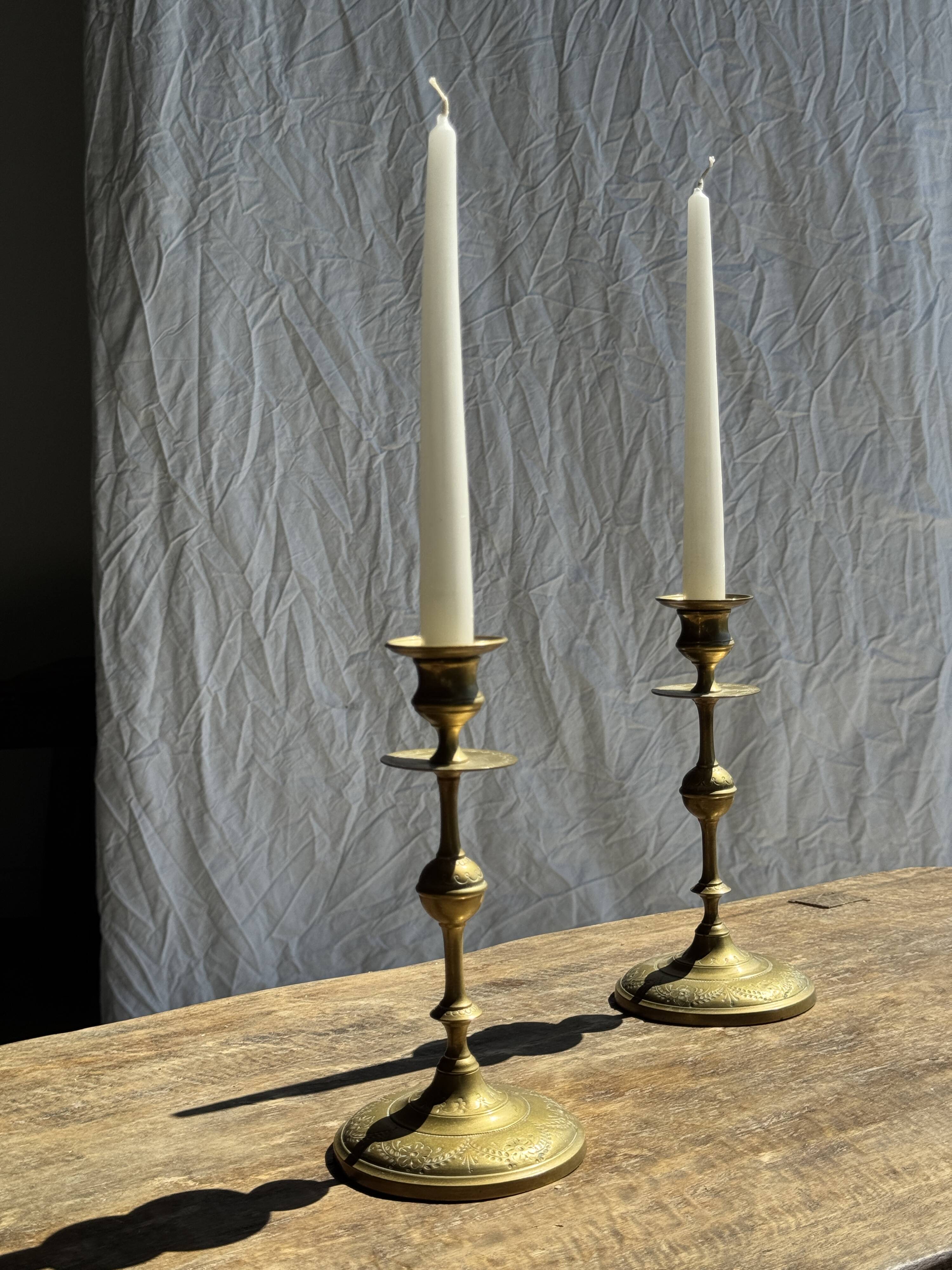 Pair of gilded candlesticks with engraved flower garland motifs H22