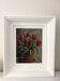 Old painting of a bouquet of red tulips.