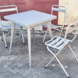 Table Tolix, industrial design, and its 3 folding chairs, designed by Xavier Pauchard