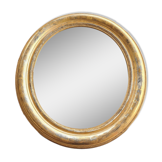 Old oval gilded wood mirror