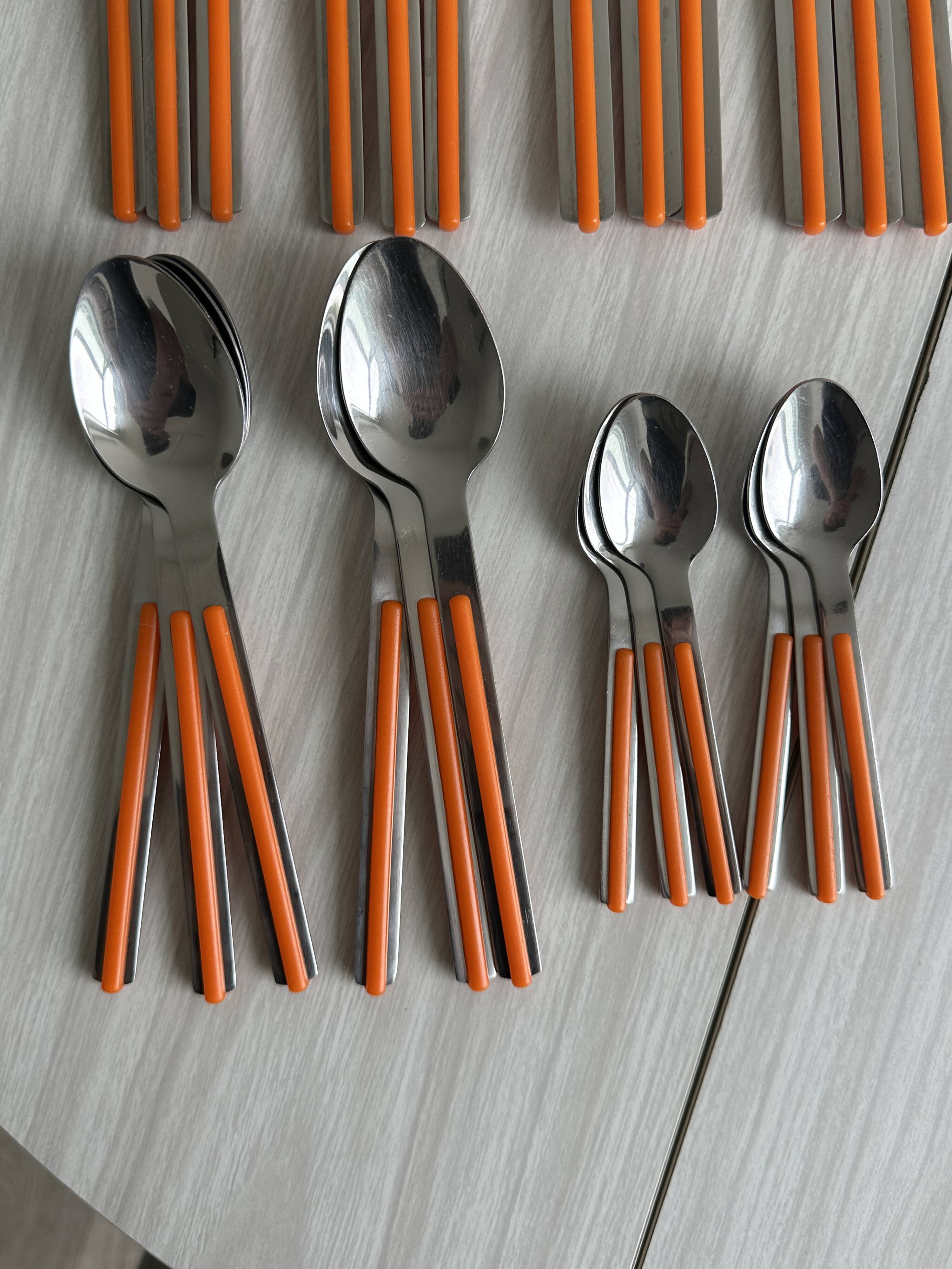 24 vintage stainless steel and orange plastic cutlery sets