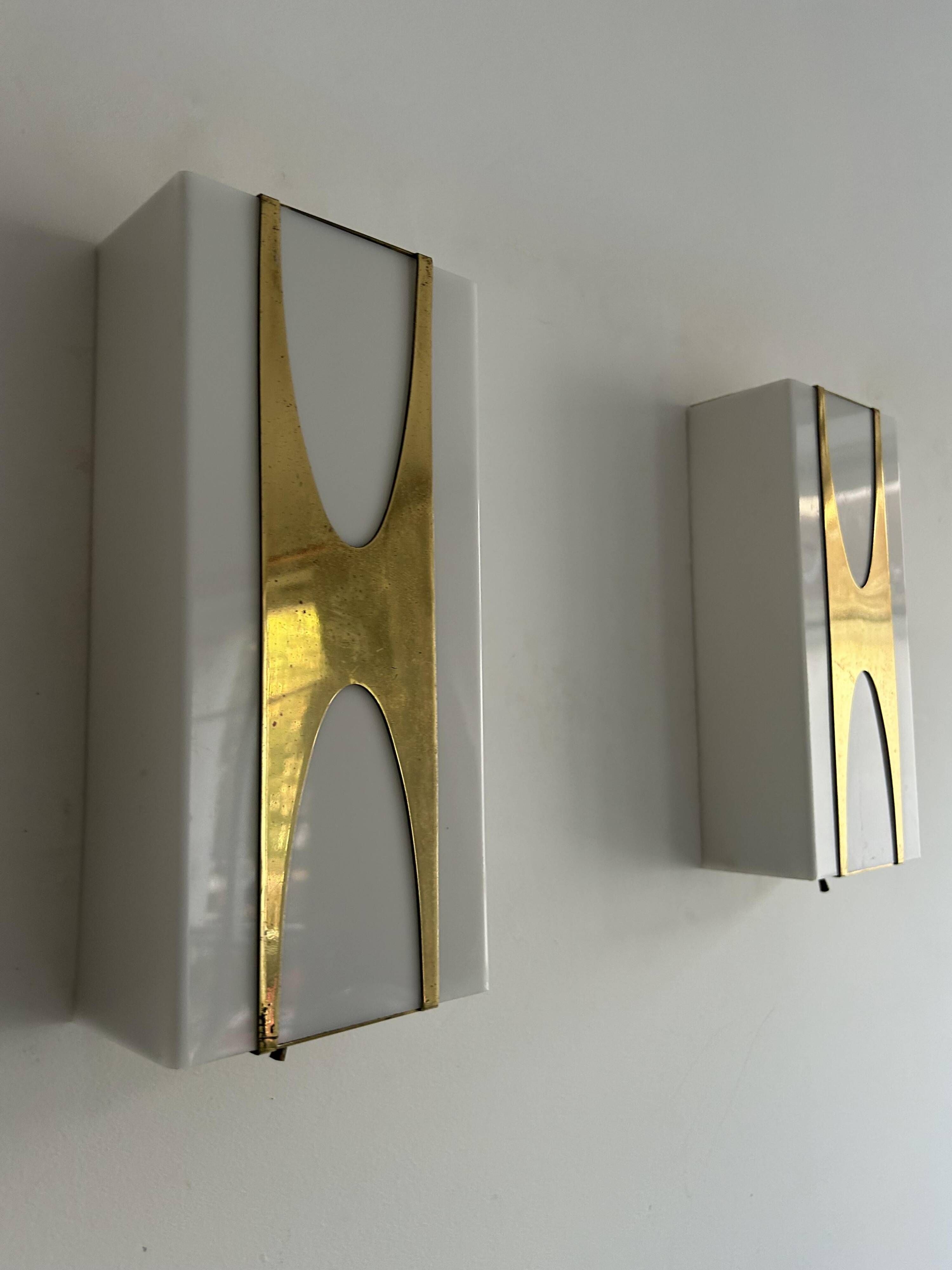 Pair of Loewy wall lights for Hilton, brass and Perspex, France 1965