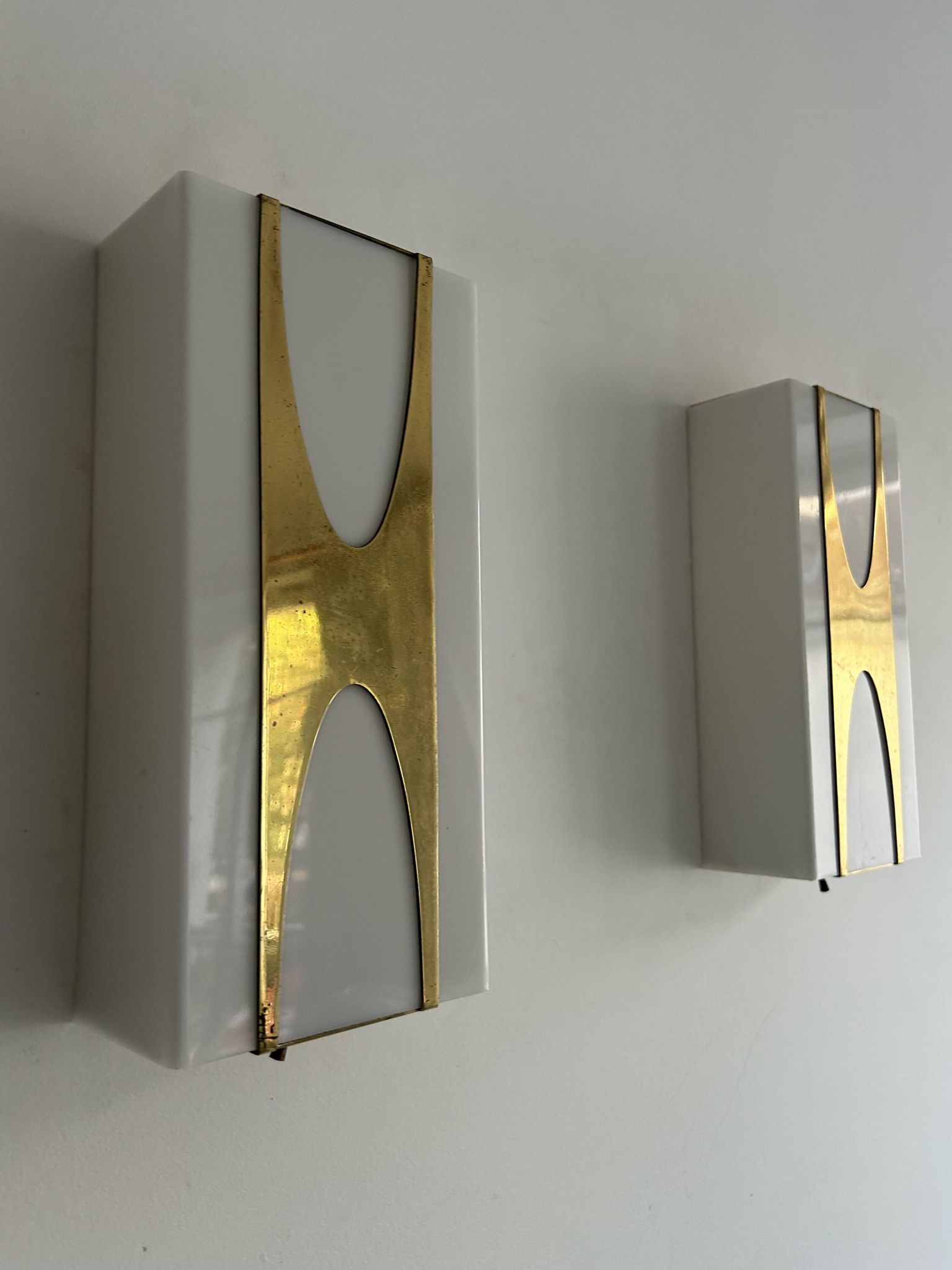 Pair of Loewy wall lights for Hilton, brass and Perspex, France 1965