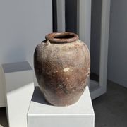 Large traditional Indonesian clay pot featuring a dragon.