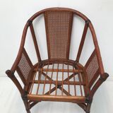 Rattan armchair with its footrest 70s