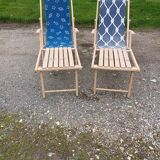 Pair of wood and fabric long chairs