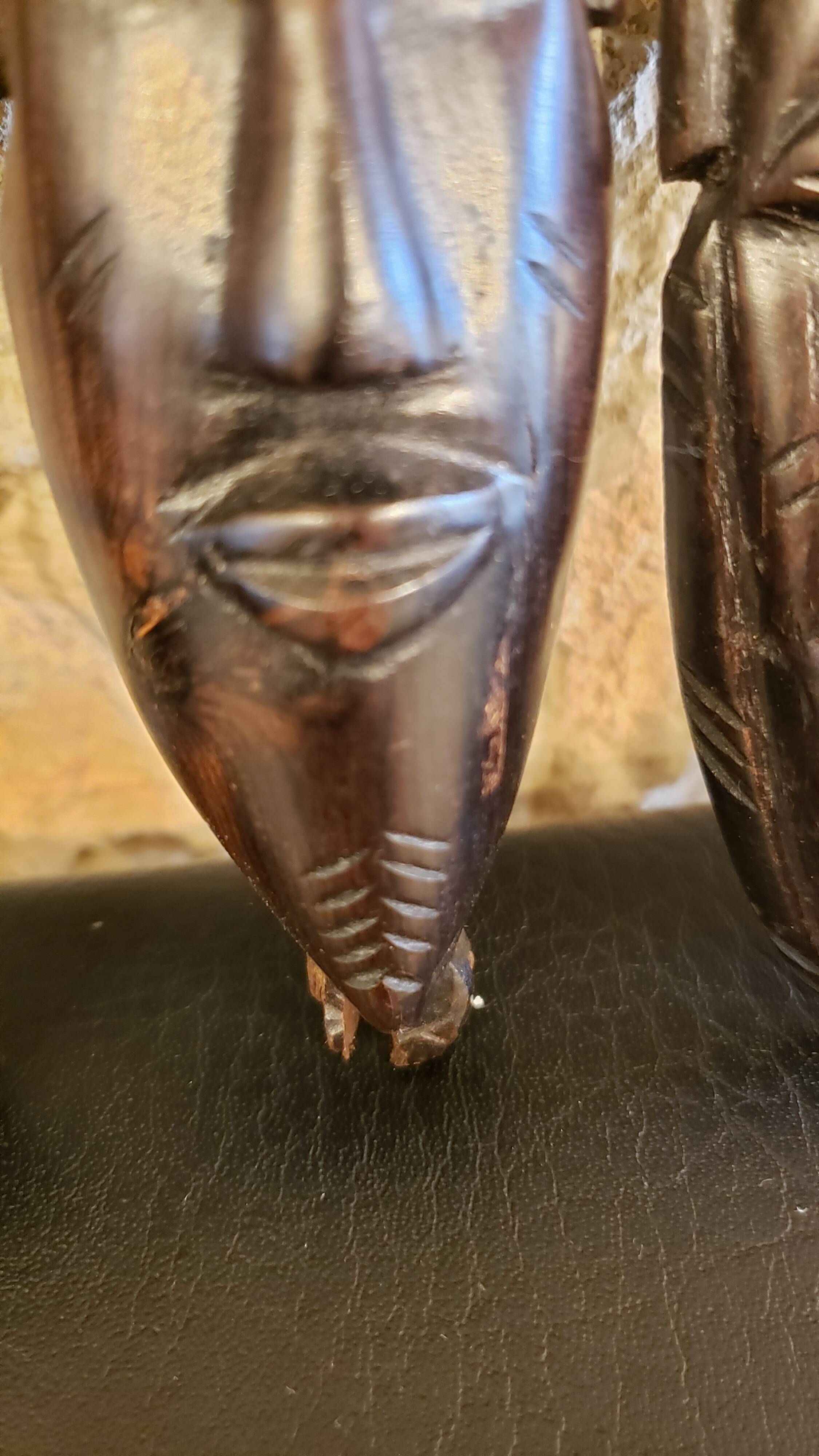 7 weekly African masks in carved wood