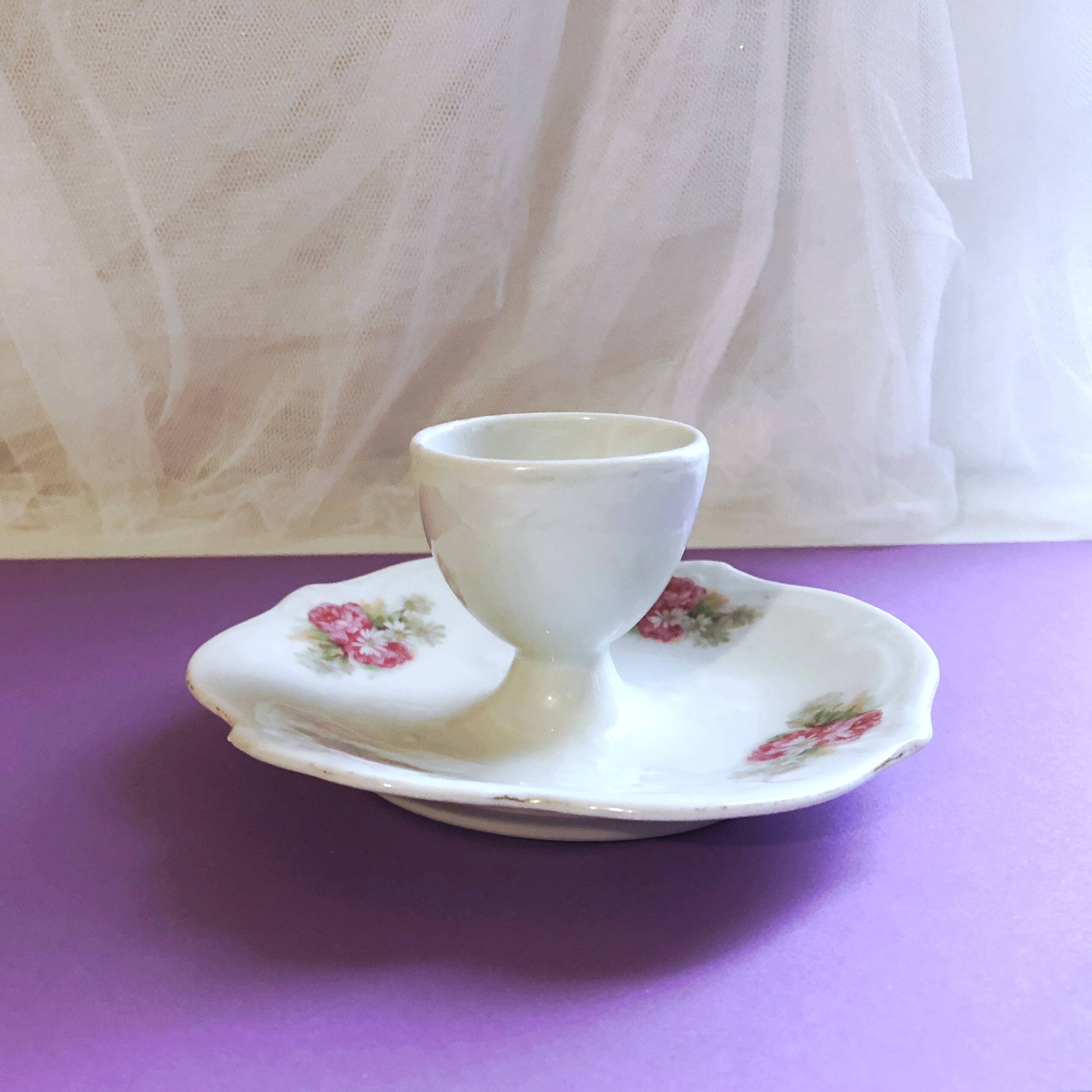 Porcelain egg cup with shabby chic style floral bouquet decoration Romanticism