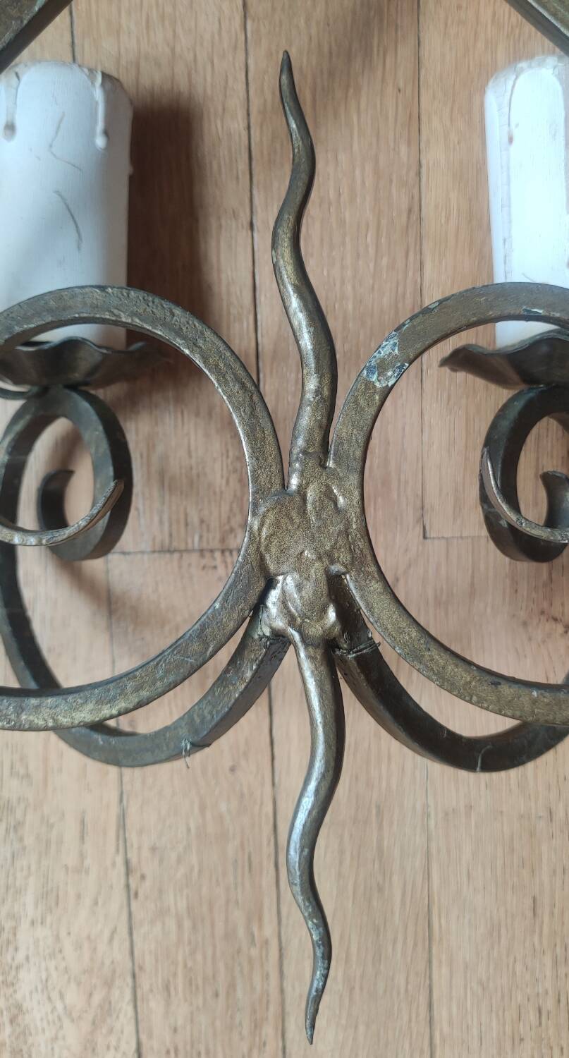 Old pair of wrought iron wall lights