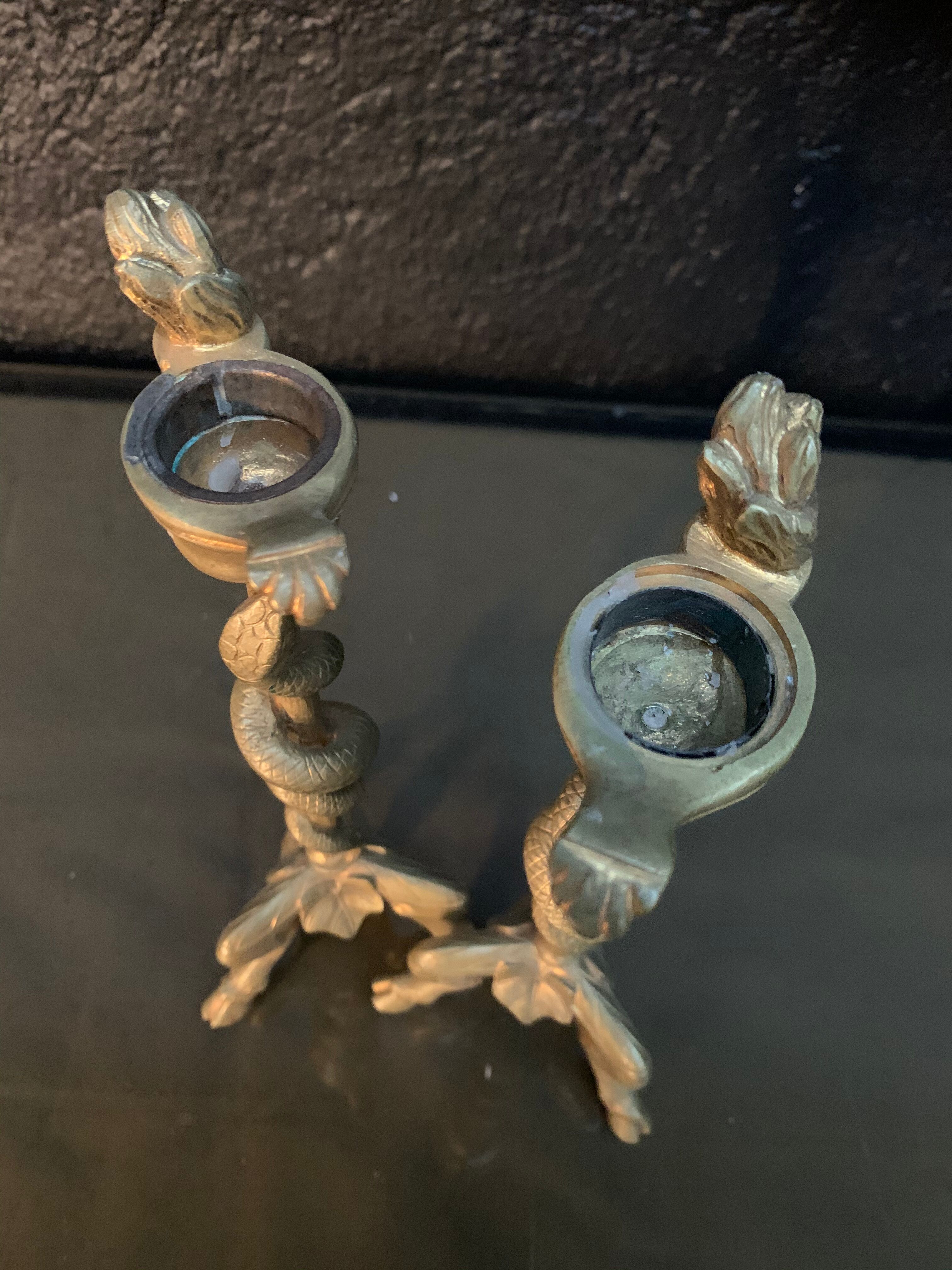 Pair of candlesticks with snakes, gilded bronze 19th century