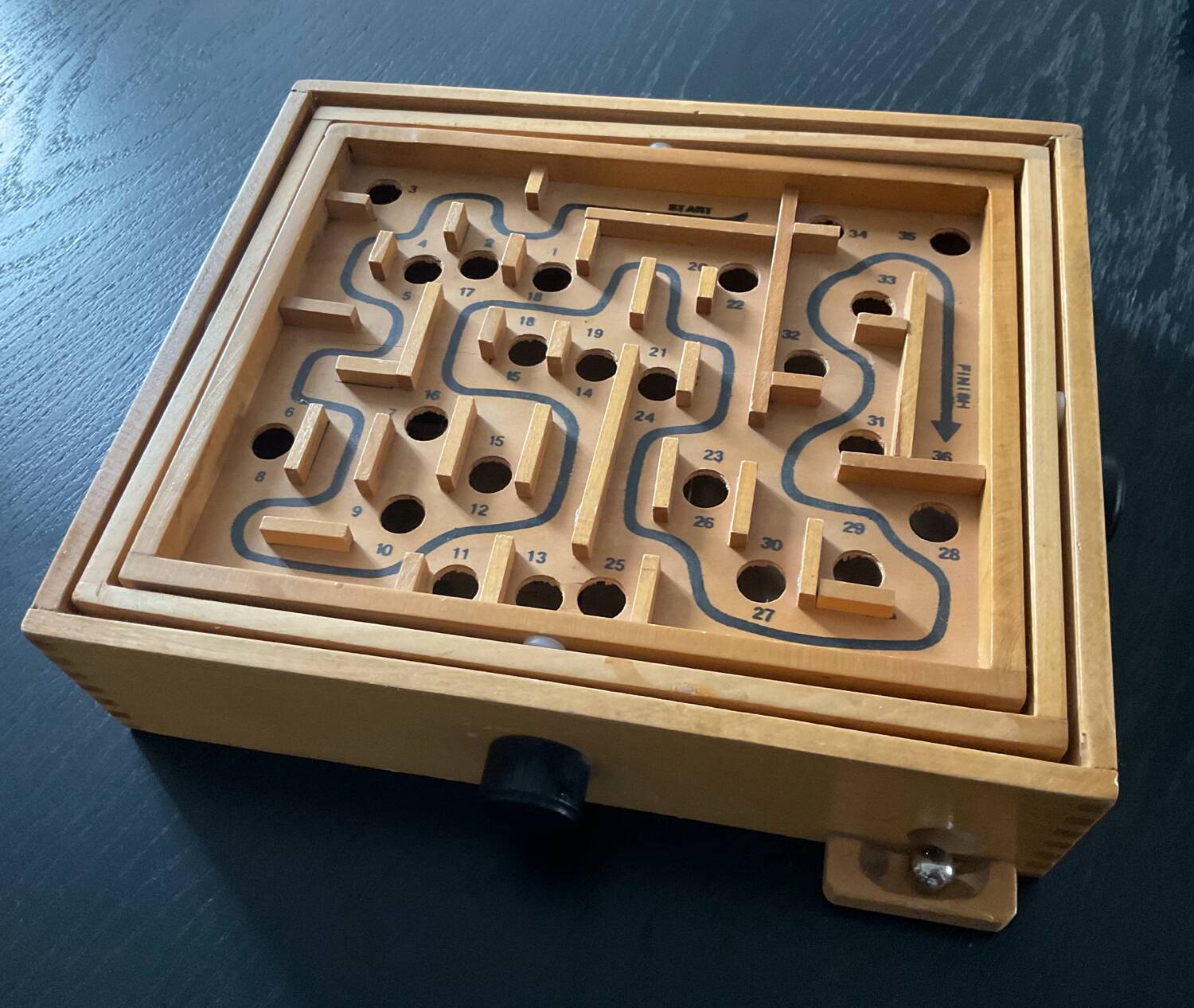Old wooden maze game