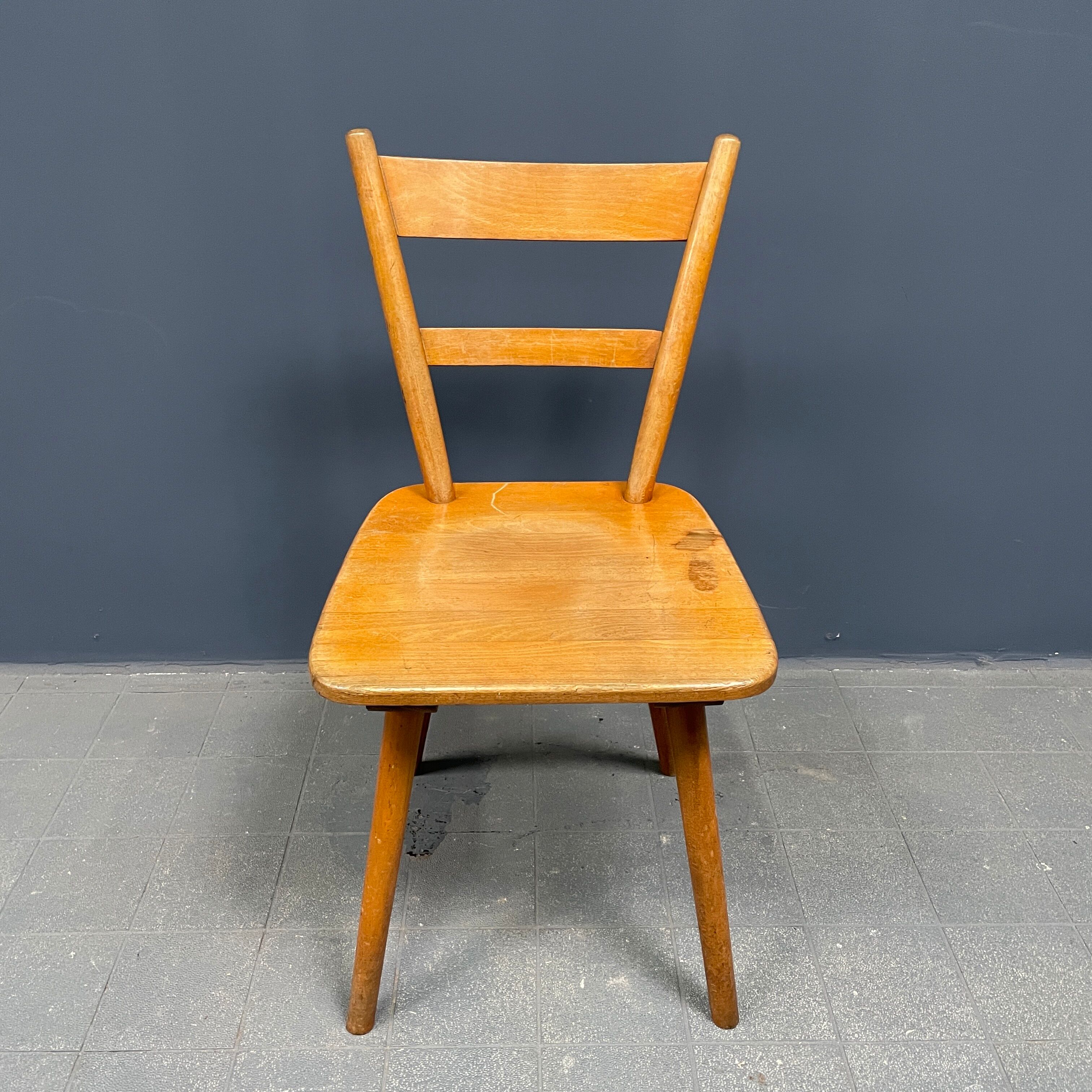 Set of eight german stick chairs from the 1950
