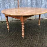 Round table in solid cherry wood, extendable with twisted legs, Louis Philippe style.
