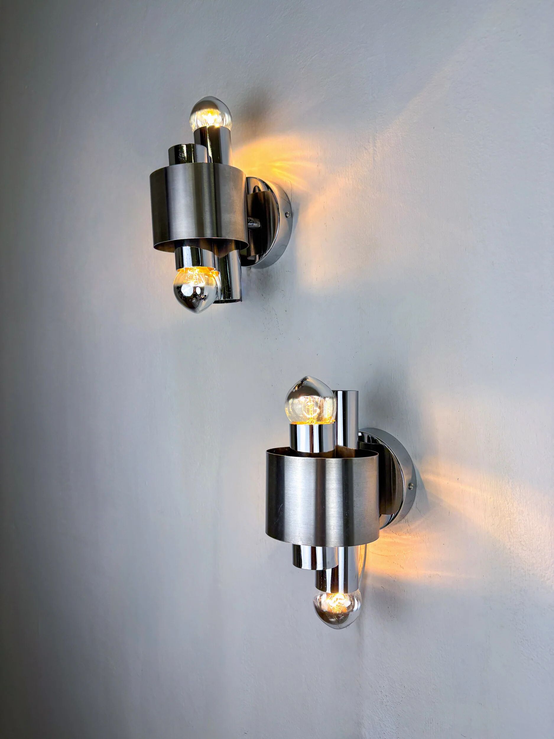 Pair of space age 2-light wall sconces, chromed metal, Italy, 1970s