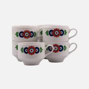 7 white porcelain cups from Winterling with coloured patterns.