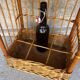 Vintage wicker bottle rack