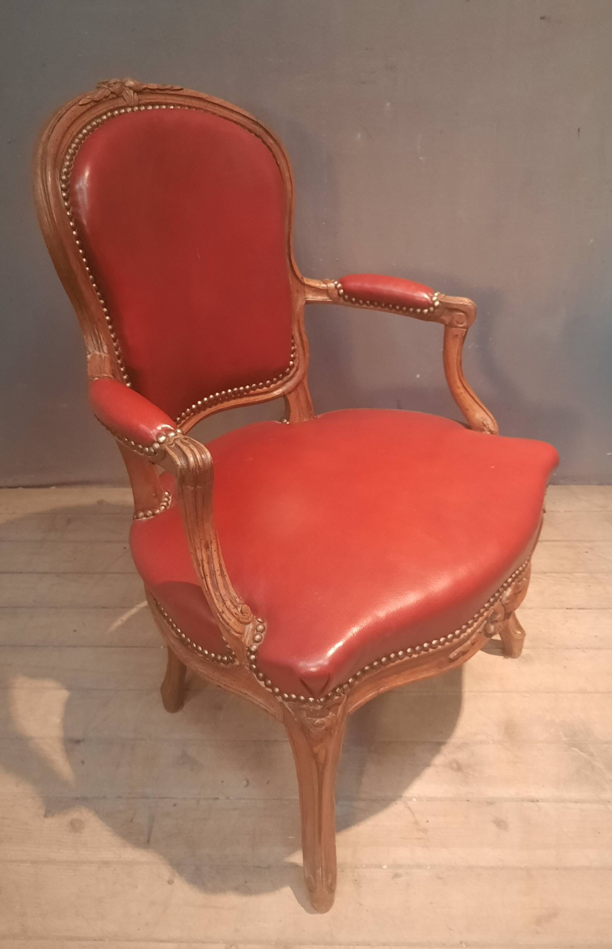 Louis XV period armchair covered in leather.