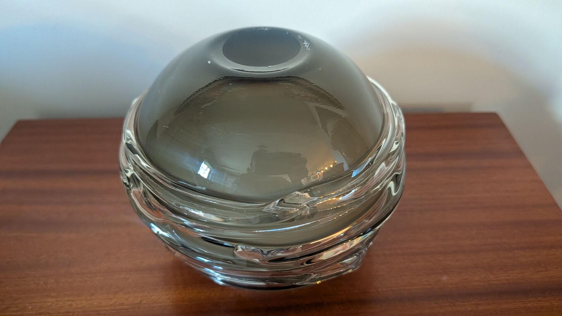 Smoky glass spherical vase with spiral applications from the 1970s.