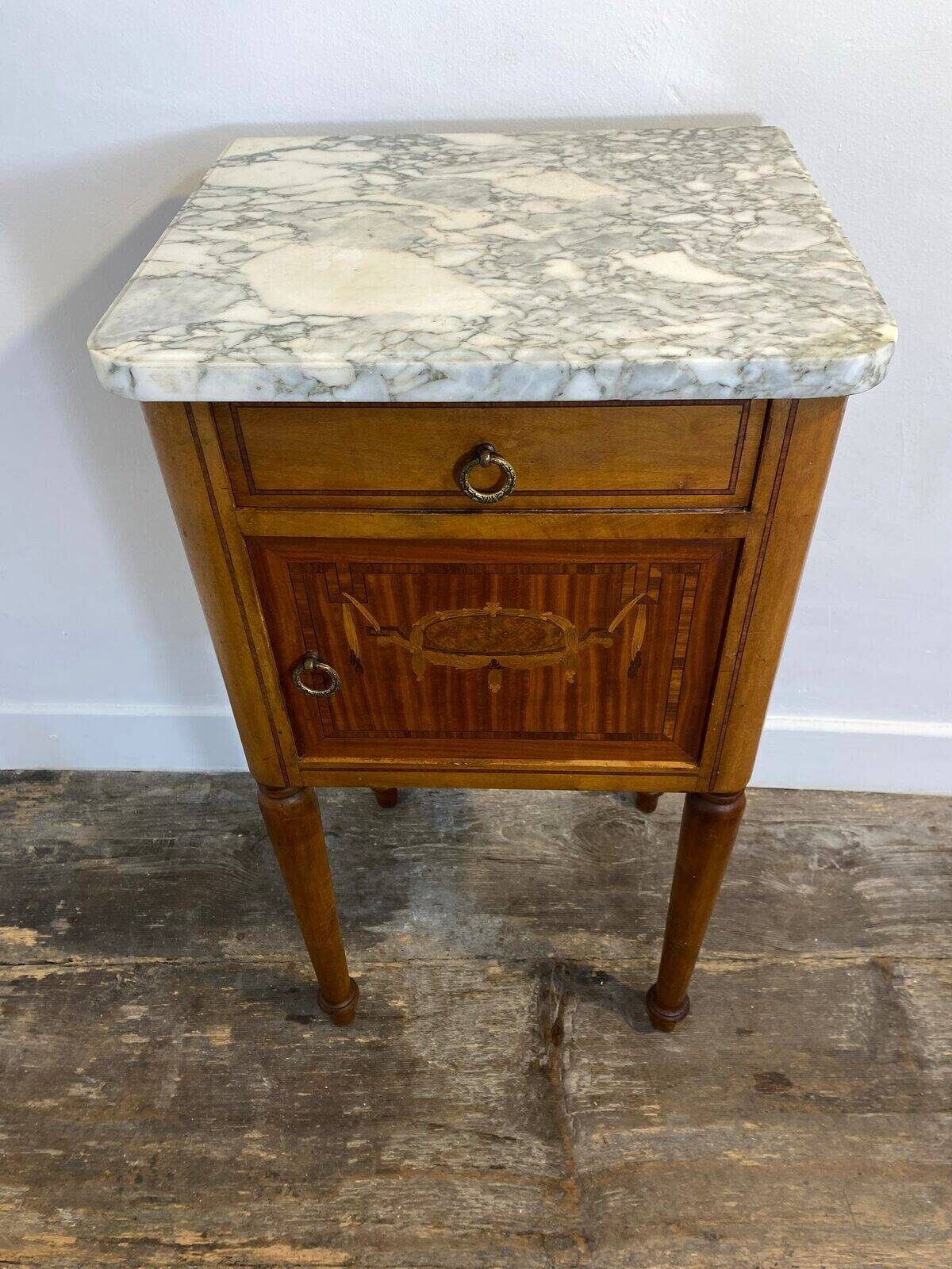 Louis XVI style bedside table, with a marble top and marquetry.