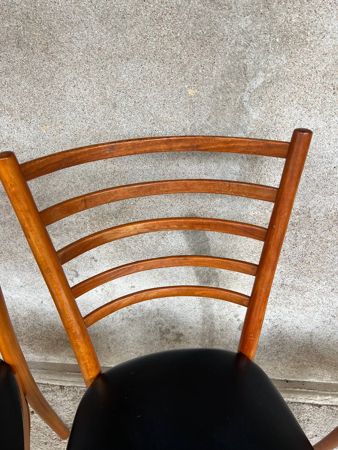Set of 4 vintage wooden chairs with faux leather.