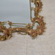 Mirror with baroque style parecloses in bronze 102 x 61 cm