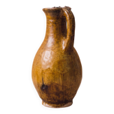 Glazed terracotta jug with a rolled rim.