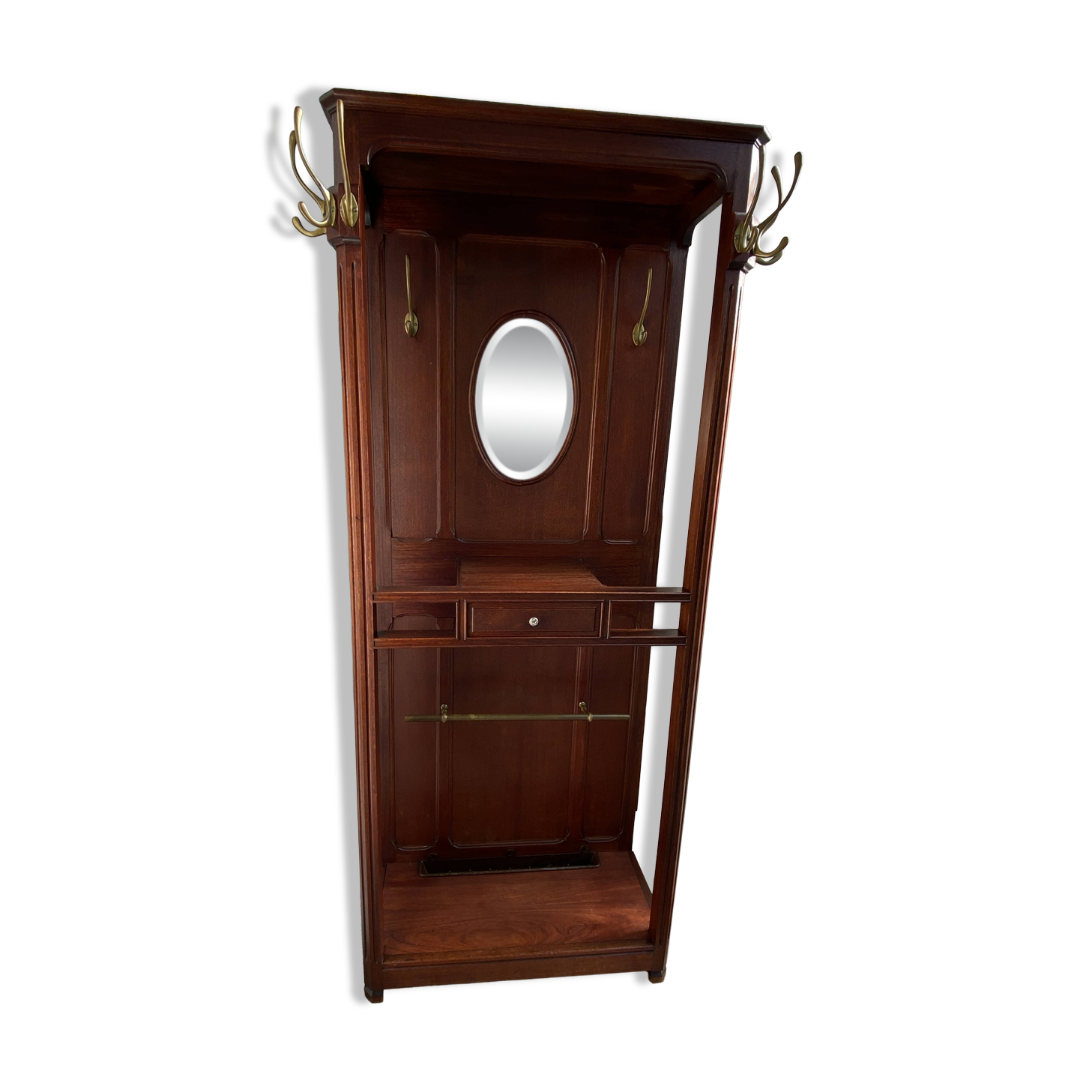 Antique wooden coat rack with mirror and shelf.