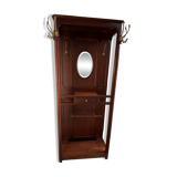 Antique wooden coat rack with mirror and shelf.