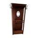 Antique wooden coat rack with mirror and shelf.