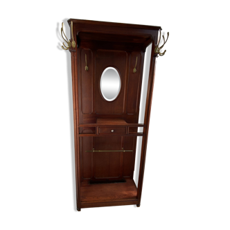 Antique wooden coat rack with mirror and shelf.