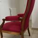 Antique Louis Philippe armchair in walnut and red fabric.