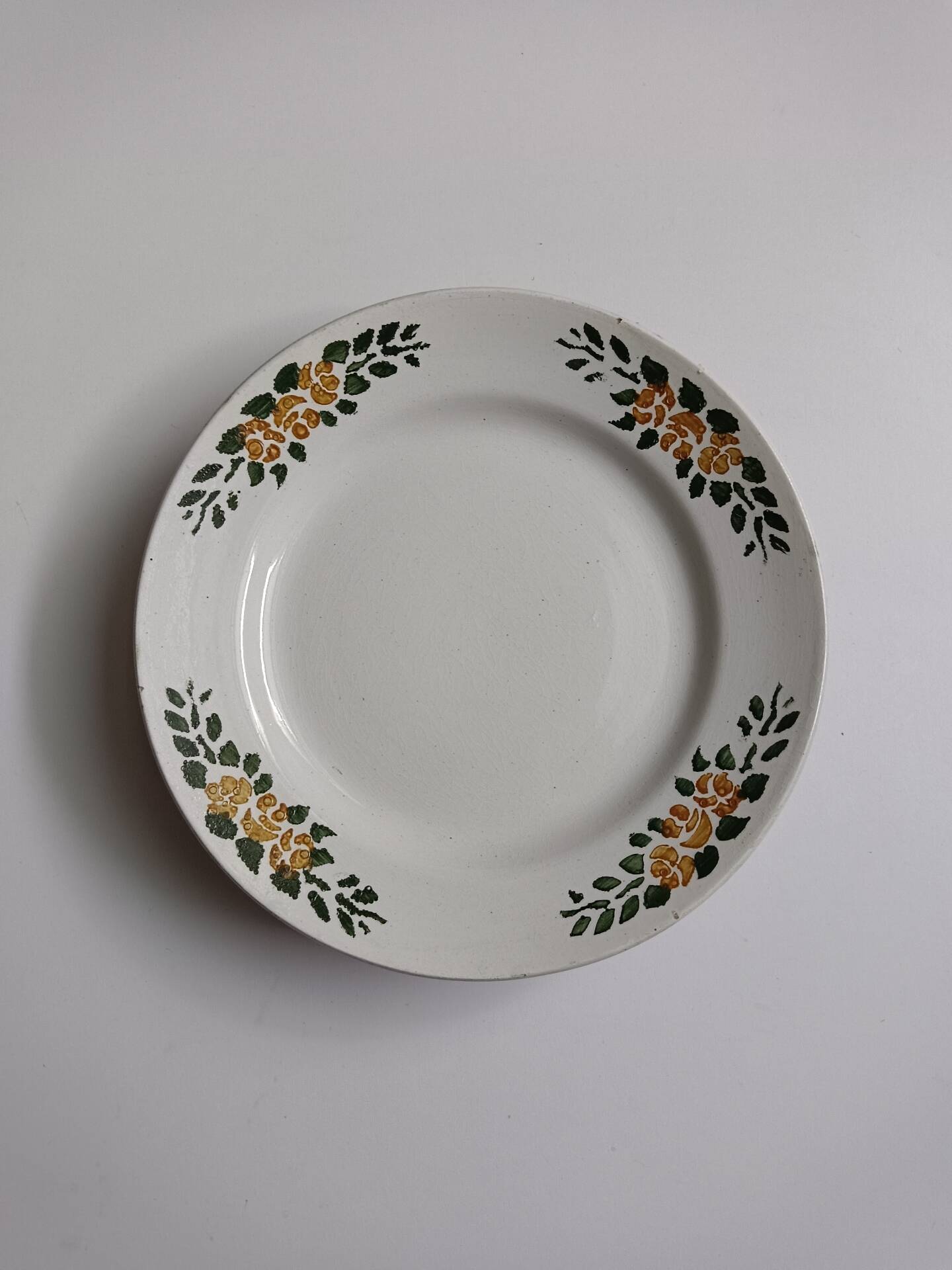 Old round footed plate signed Labrut brothers flowers