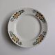 Old round footed plate signed Labrut brothers flowers
