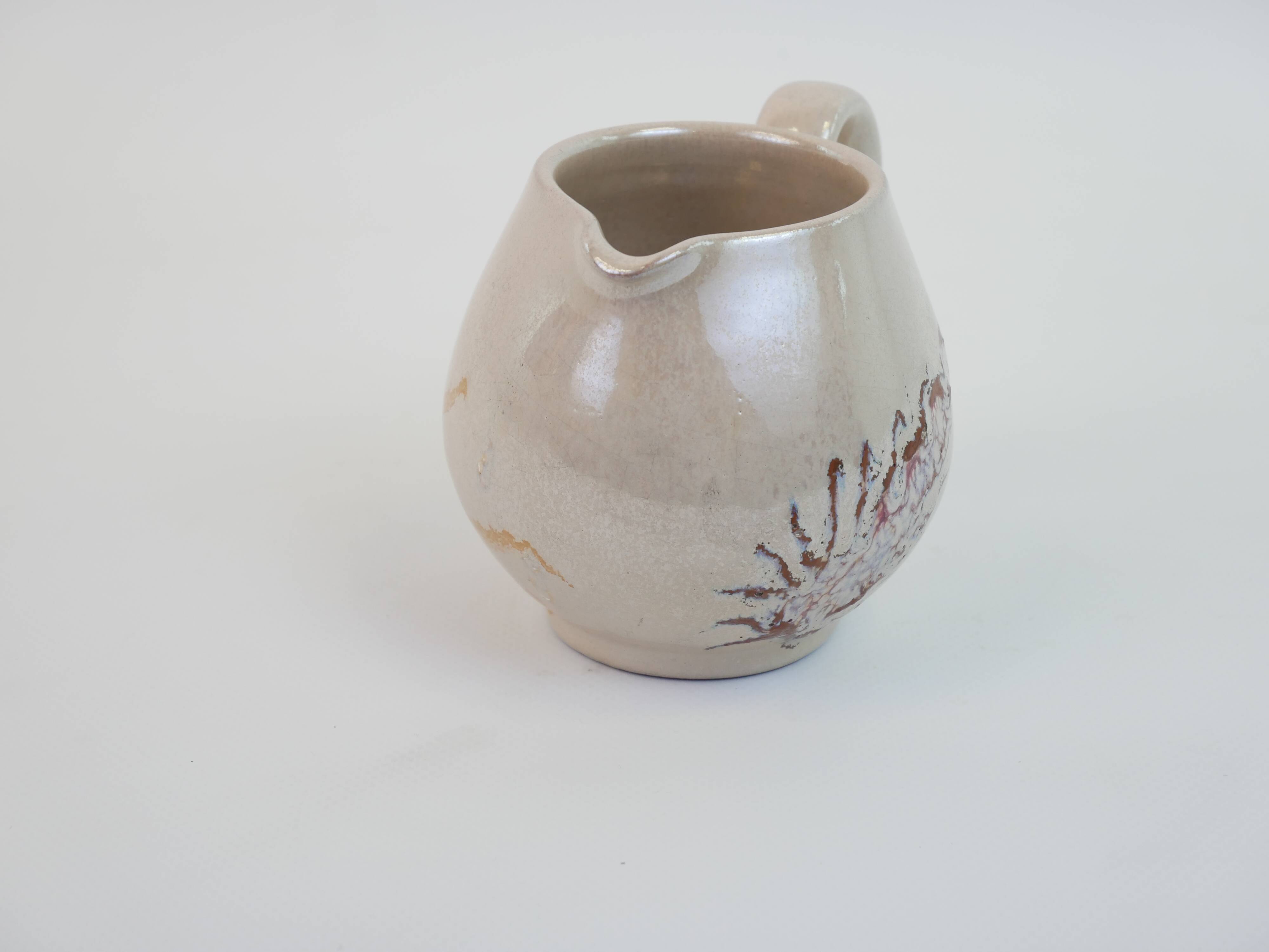 Pair of ceramic milk jugs signed La Roue Vallauris