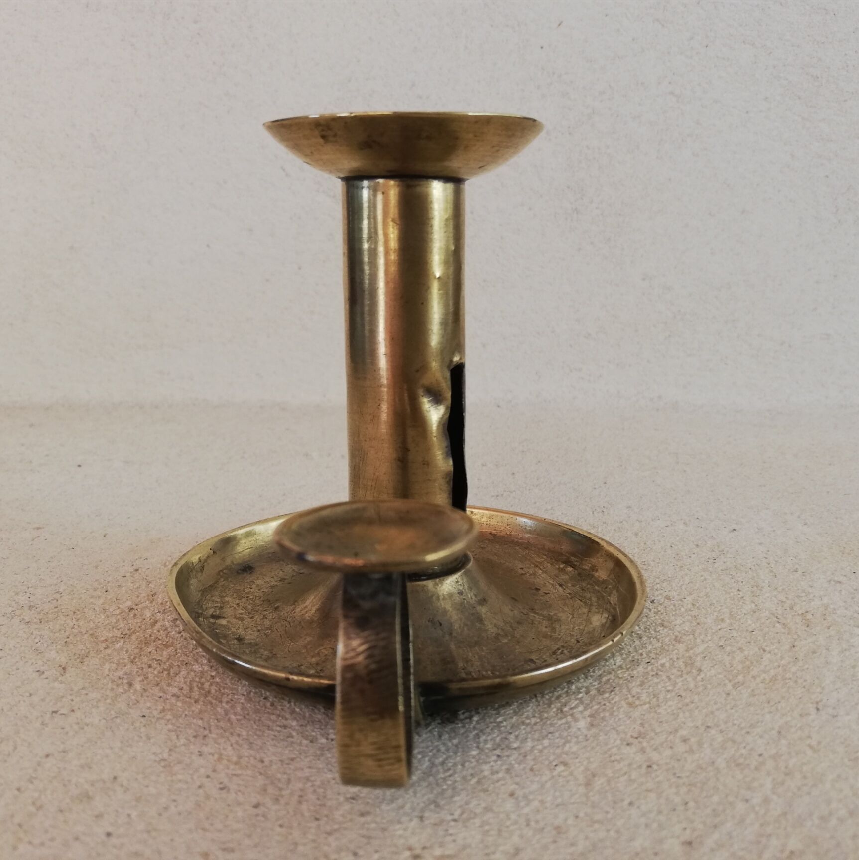 Brass hand candle holder
