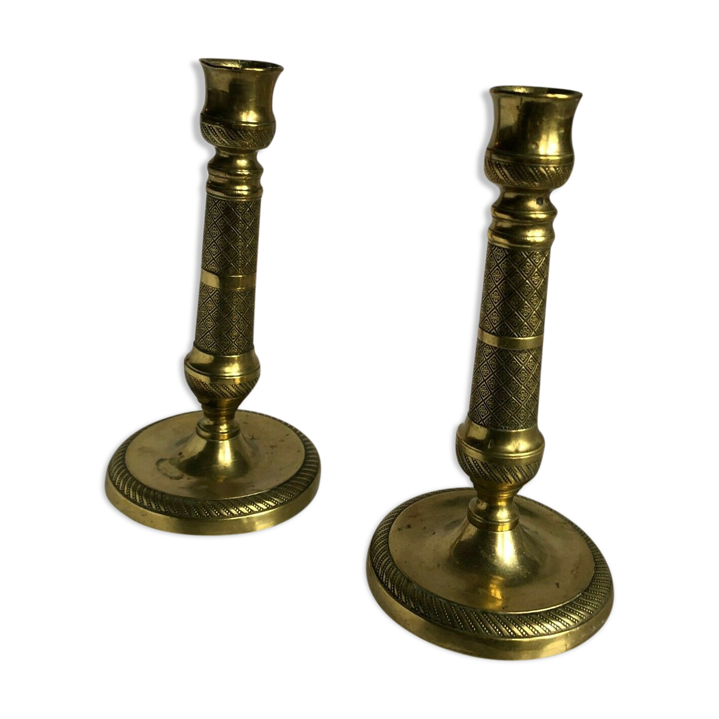 Pair of bronze and brass candlesticks