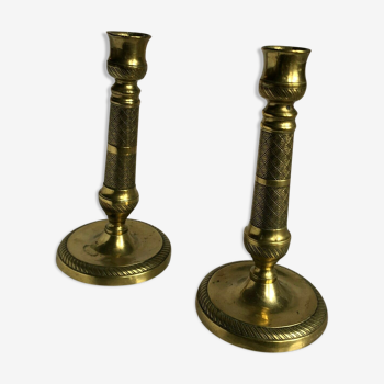 Pair of bronze and brass candlesticks