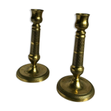 Pair of bronze and brass candlesticks