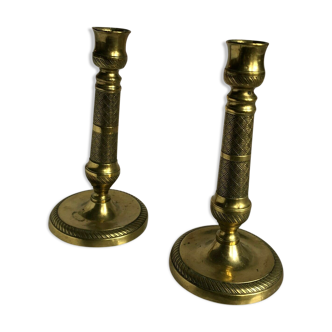 Pair of bronze and brass candlesticks