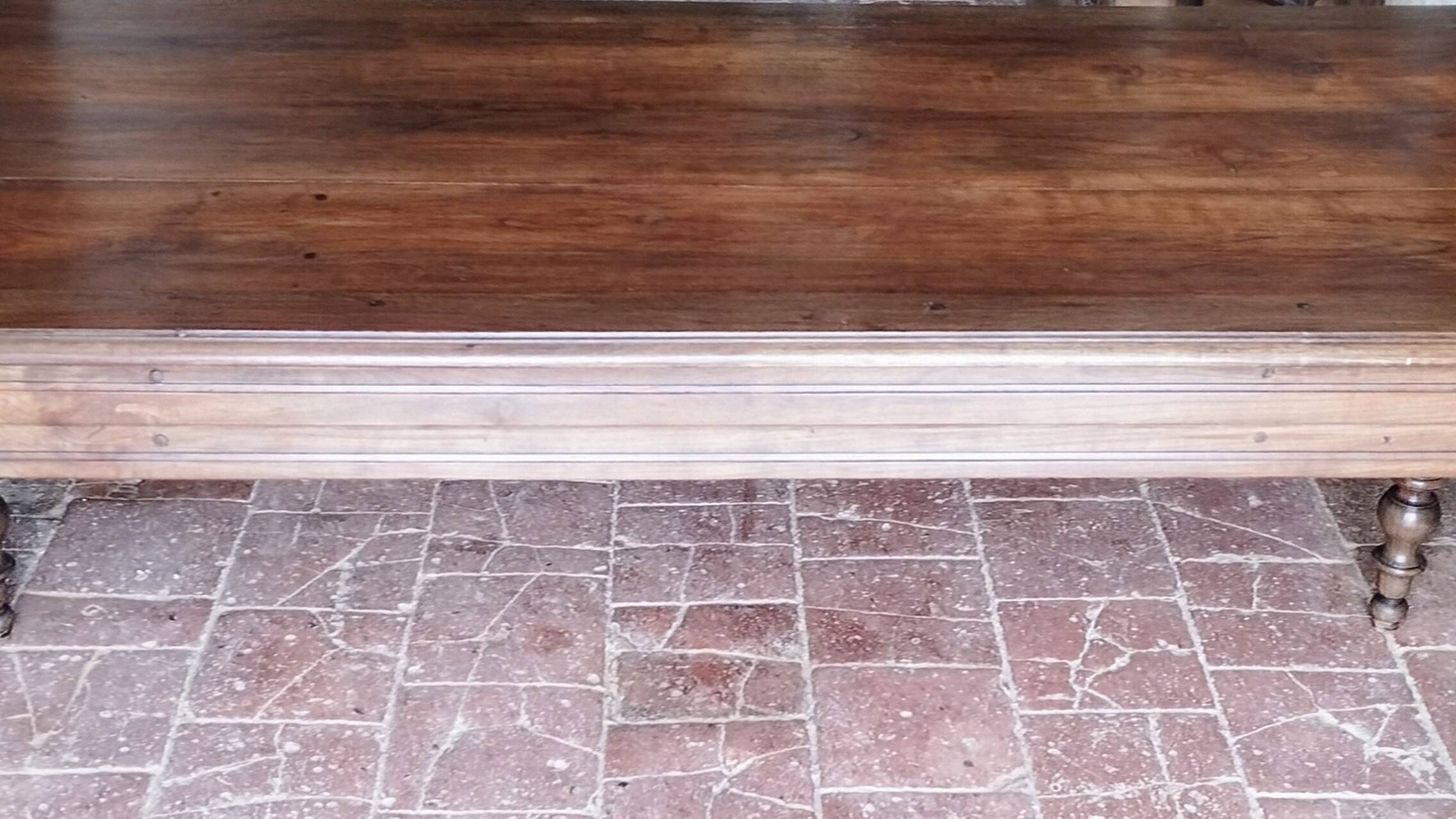 Old French farmhouse table in walnut, turned legs, waxed finish