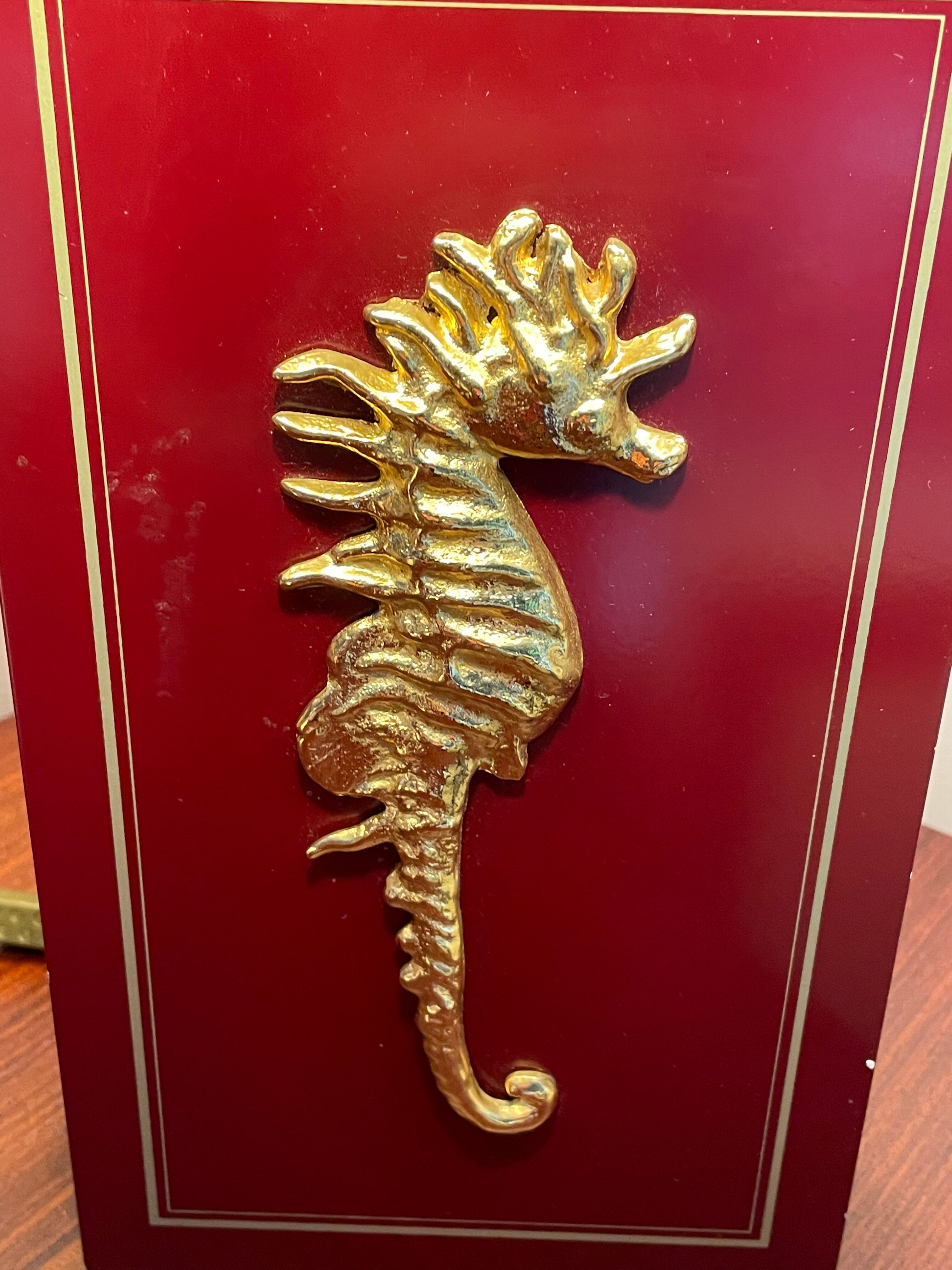 Pair of table lamps in Bordeaux lacquered wood and brass seahorse