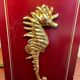 Pair of table lamps in Bordeaux lacquered wood and brass seahorse