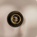 Milky white Holmegaard wall lamp with glass shade and a brass detail on top. Wooden wall bracket